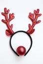 Top view funny Christmas antlers of a deer and a red ball as a nose isolated on white background Royalty Free Stock Photo