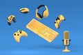 Top view gamer gears like joystick, keyboard, headphones and microphone
