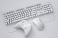 Top view gamer gears like joystick, keyboard and mouse on monochrome background.