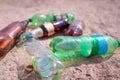 Top view Garbage and plastic bottles on a beach sand