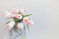 Top view of gentle pink tulips on grey background with copy space Royalty Free Stock Photo