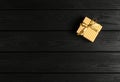 top view of a gift box on a black wooden background Royalty Free Stock Photo