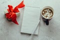 gift box, blank notebook, pen and hot chocolate, winter holidays cheklist or to do list Royalty Free Stock Photo