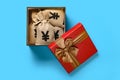 gift box full with RMB money bags on blue background Royalty Free Stock Photo