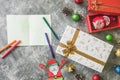 Top view of Gift boxes with Christmas decoration and card on gray grunge background. Royalty Free Stock Photo