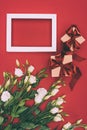 Top view of gift boxes, empty frame and beautiful eustoma flowers Royalty Free Stock Photo