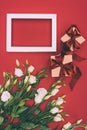 top view of gift boxes, empty frame and beautiful eustoma flowers Royalty Free Stock Photo