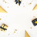 Top view of gift boxes and party accessories in various black, white and golden designs. Flat lay, copy space. A concept of Royalty Free Stock Photo