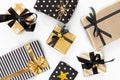 Top view of gift boxes in various black, white and golden designs. Flat lay. A concept of Christmas, New Year, birthday celebratio Royalty Free Stock Photo