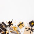 Top view of gift boxes in various black, white and golden designs. Flat lay, copy space. A concept of Christmas, New Year, birthda Royalty Free Stock Photo