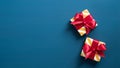 Top view gift boxes wrapped premium paper with red ribbon bow. Flat lay two Christmas holiday presents on dark blue background Royalty Free Stock Photo