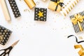 Top view of gift boxes and wrapping materials in various black, white and golden designs. Flat lay, copy space. A concept of Chris Royalty Free Stock Photo