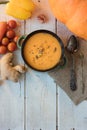 Top view of ginger carrot cream soup on white surface. Royalty Free Stock Photo