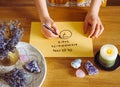 Top view of girl calculate Life path number on paper in home table.