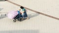 Top view of girl use wheel baby chair walk in pedestrian street Royalty Free Stock Photo