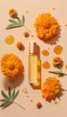 top view of glass bottle of aroma oil and marigold flowers on beige background