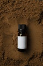 Top view of glass bottle of organic cocoa oil for beauty treatments.Verticval image