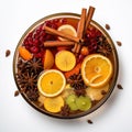 Top view of Glass bowl of hot Christmas winter punsh with spices and citrus on the white background