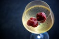 Glass Of Chilled White Wine With Strawberries On Blue Pool Water Background