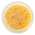 Top view of glass jar with yellow caviar of pike