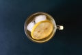 Top view of a glass of lemon iced tea on dark background Royalty Free Stock Photo