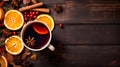 Top view of a Glass of mulled wine on wooden background with copy space. Warming red wine drink. Glass of hot red wine with spices