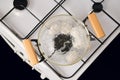 Top view of glass saucepan with boiling eggs on a gas stove