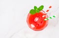 Top view of a glass of watermelon juice on a light background. copy space flat lay