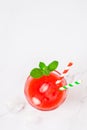 Top view of a glass of watermelon juice on a light background. copy space flat lay