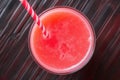 top view of a glass of watermelon juice with a straw Royalty Free Stock Photo