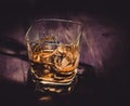 Top of view of glass of whiskey on wood table, warm atmosphere, time of relax with whisky