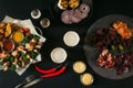 top view of glasses of beer, vegetables, baked potatoes with roasted chicken, various sauces and craft meat Royalty Free Stock Photo