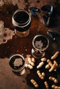 top view of glasses of cold beer peanuts and mussels shells Royalty Free Stock Photo