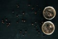 top view of glasses of cold brewed coffee with ice on dark surface with roasted coffee