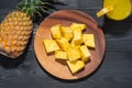 Top view of glasses of pineapple juice and pineapple fruit on a