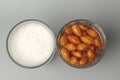 Top view of glasses with soaked almonds and with almonds milk. Showing ingredients needed to prepare almonds milk