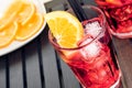 Top of view of glasses of spritz aperitif aperol cocktail with orange slices and ice cubes near plate of slices oranges Royalty Free Stock Photo