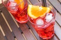 Top of view of glasses of spritz aperitif aperol cocktail with orange slices and ice cubes