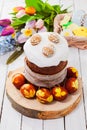 Top view glazed Easter bread with eggs on wooden stand Royalty Free Stock Photo