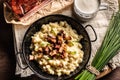 Top view of the gnocchi with cheese food halusky with sour milk and a bunch of chives Royalty Free Stock Photo