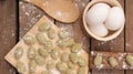 Top view of Gnocchis on a wooden dock with flour on them