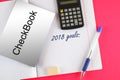 Top view 2018 goals. Notebook with checkbook, pen and calculator. Royalty Free Stock Photo