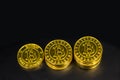 Top view Gold Bitcoin stack on black background.