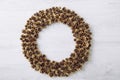 Top view of gold color pine cone wreath. Minimalist Christmas background.