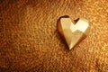 Top view of gold heart over bronze background Royalty Free Stock Photo