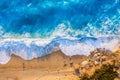 Top view of the golden beach and fluorescent blue sea of Milos Beach on the island of Lefkada, Greece