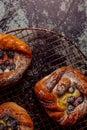 Top view of golden chese danish pasties with blackberries and powder sugar Royalty Free Stock Photo