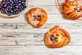 Top view of golden chese danish pasties with blackberries and powder sugar Royalty Free Stock Photo