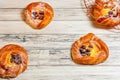 Top view of golden chese danish pasties with blackberries and powder sugar Royalty Free Stock Photo