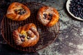 Top view of golden chese danish pasties with blackberries and powder sugar Royalty Free Stock Photo